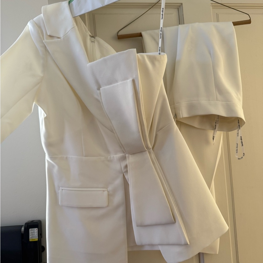 Elegant Cream Women's one shoulder top and pants set.